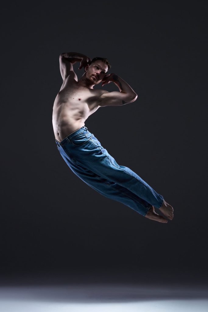 Photo of male dancer doing a leap