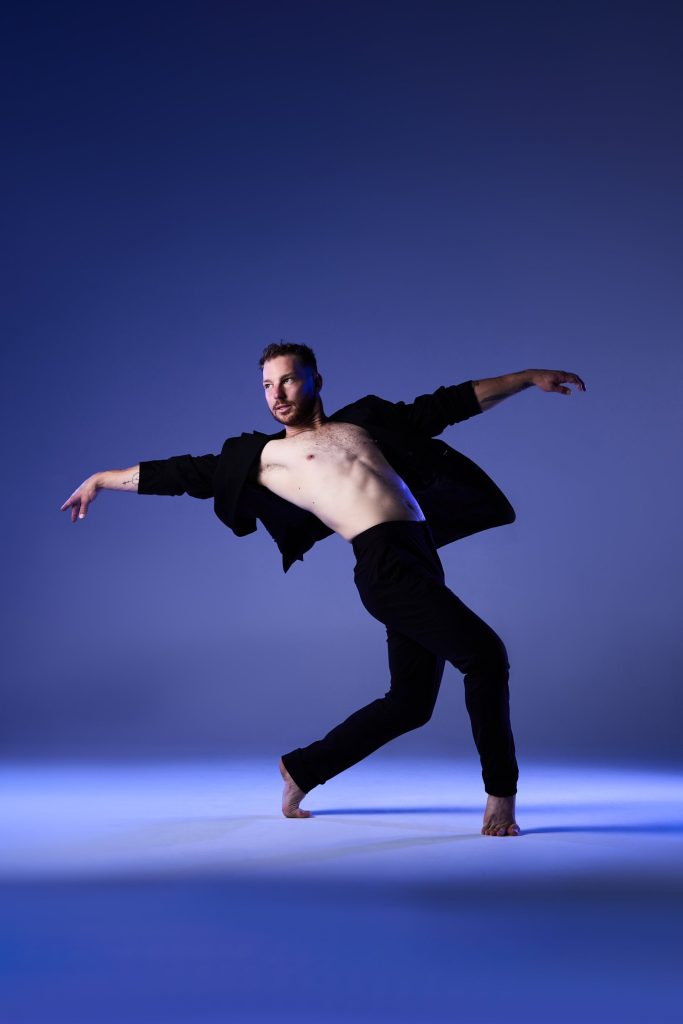 Photo of male dancer throwing his shirt