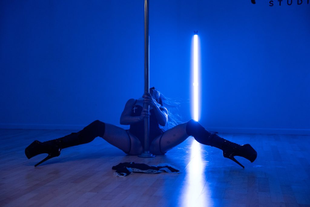 Photo of a pole dancer doing a hair flick